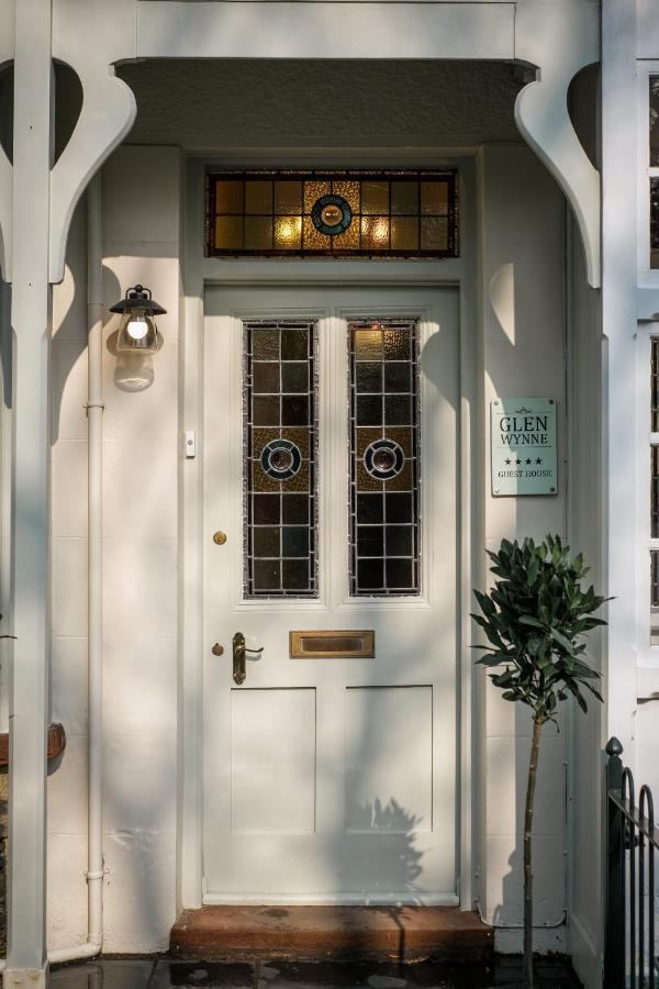 The front door of Glen Wynne Guest House with stained glass