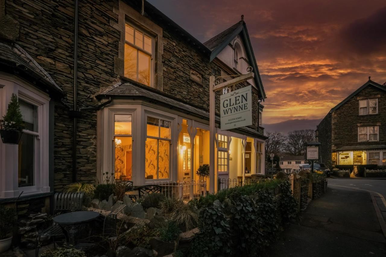 Glen Wynne Guest House, a Victorian Lakeland stone building on Broad Street, Windermere, at dusk