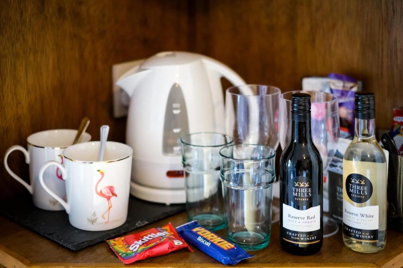 Hospitality tray at Glen Wynne Guest House with kettle, cups, water and biscuits