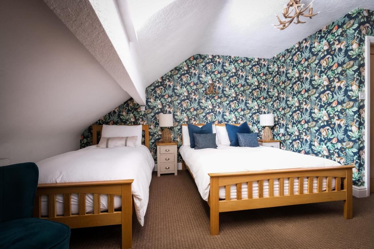 Twin bedroom in the eaves at Glen Wynne Guest House with two single beds